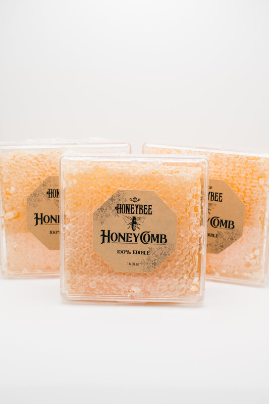 Three packages of pure raw honeycomb are displayed against a white background. Each package is labeled "Honeybee Honeycomb 1 lb. 100% Edible" and shows the textured, golden honeycomb inside—perfect for charcuterie boards or adding a touch of sweetness to your culinary creations.